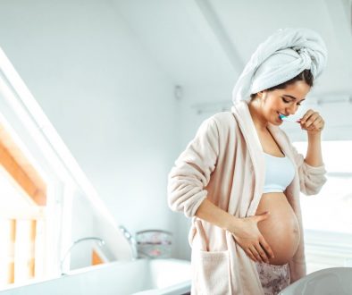Pregnant,Female,Brushing,Teeth,At,Home